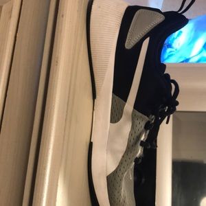 The brand is puma the size is 7.5 and the color is gray black and white